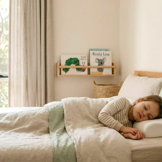 child sleeping on a low ergonomic latex pillow showing proper neck support and comfortable side sleeping position