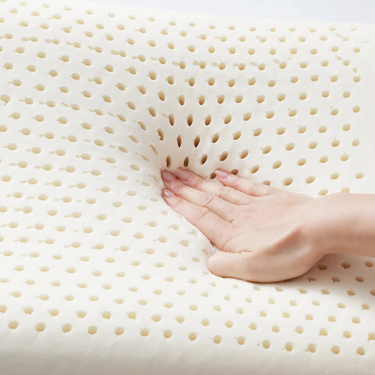Hand pressing the pillow - PAPATYA Baby Flat Pillow with Soft Contour & Flat Ventilated Design
