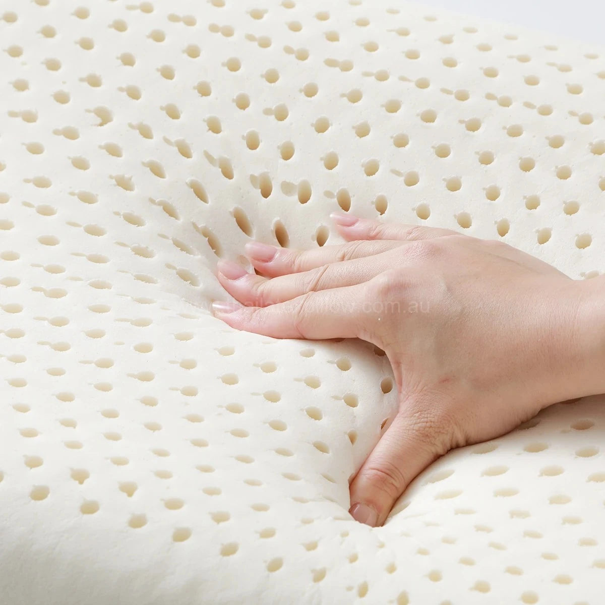 Hand pressing the pillow - Neck Support & Flat Ventilated Design (Ages 3–14)
