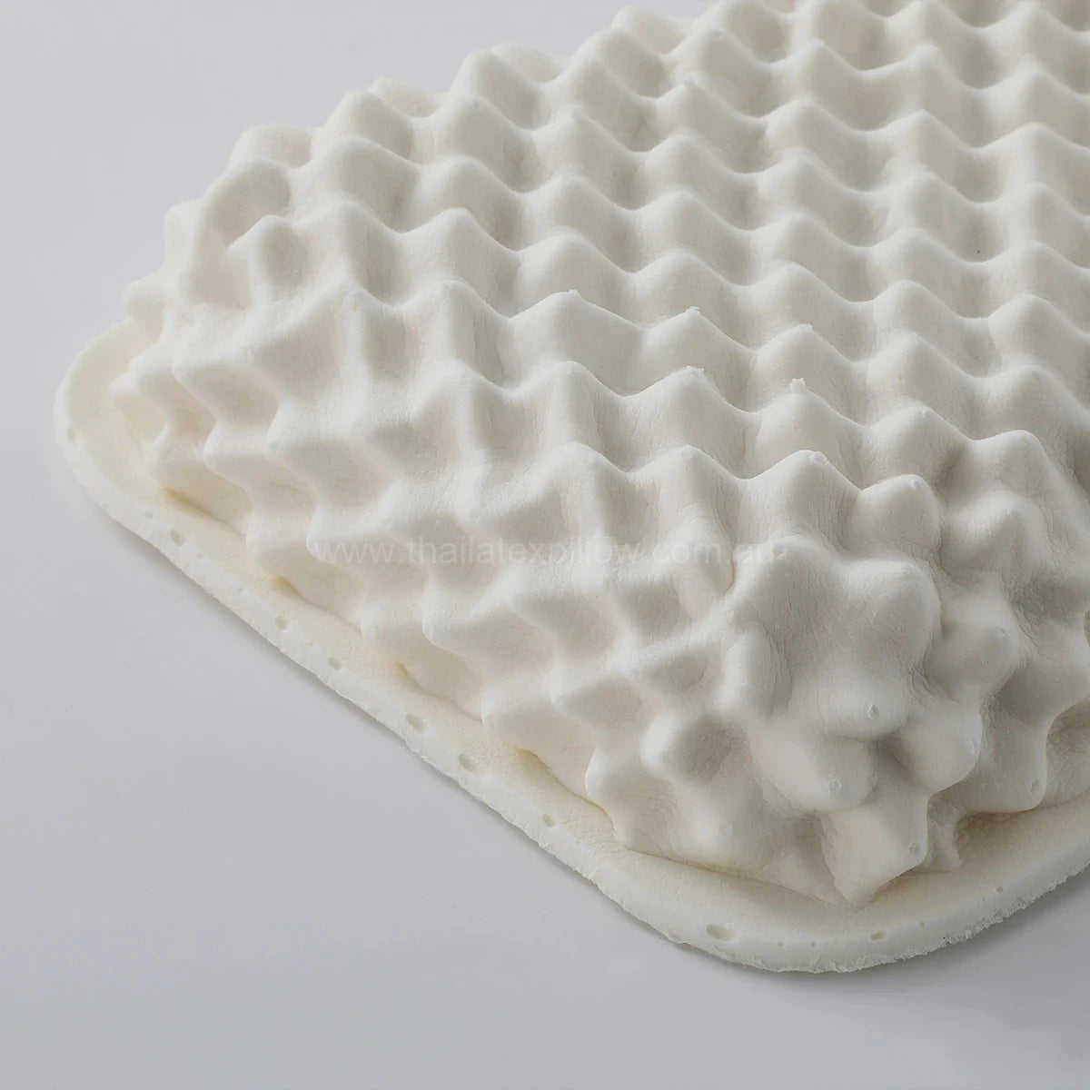 45-degree view without pillow cover details 1 - PAPATYA Latex Side Sleeper Beauty Pillow Peanut Shape with Massage Nodules
